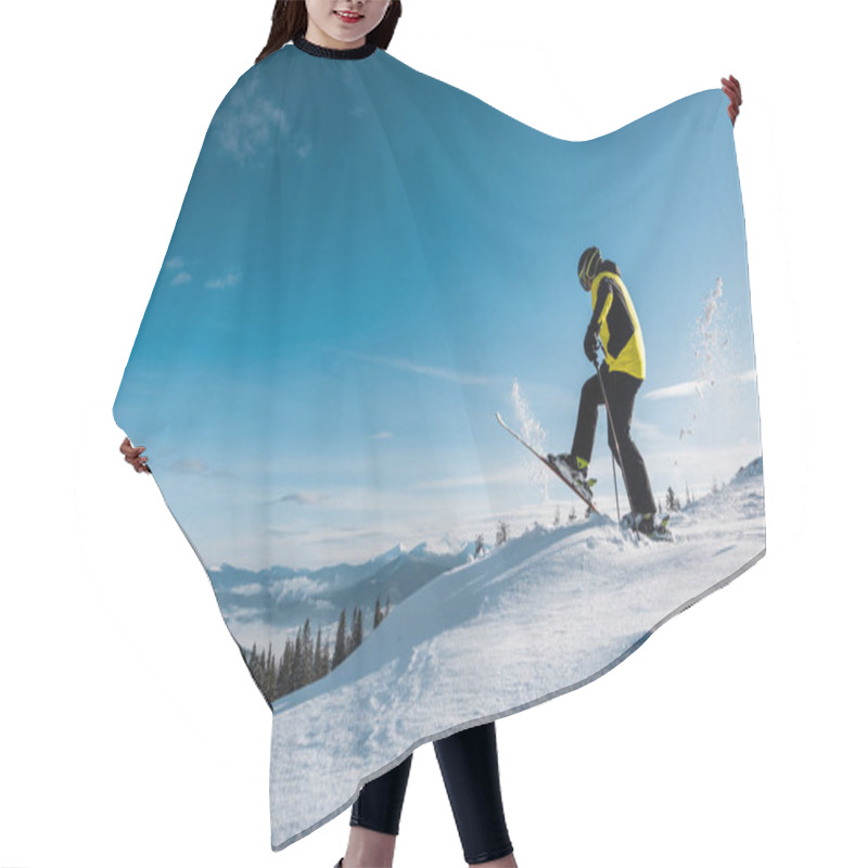 Personality  Side View Of Skier Holding Ski Sticks And Making Step Against Sky In Mountains  Hair Cutting Cape