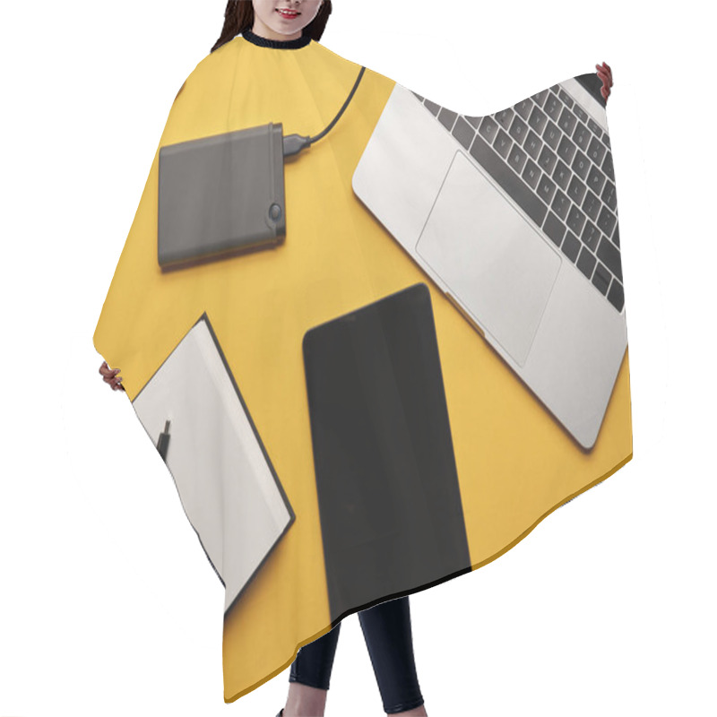 Personality  Top View Of Various Gadgets With Opened Notebook Lying On Yellow Surface Hair Cutting Cape