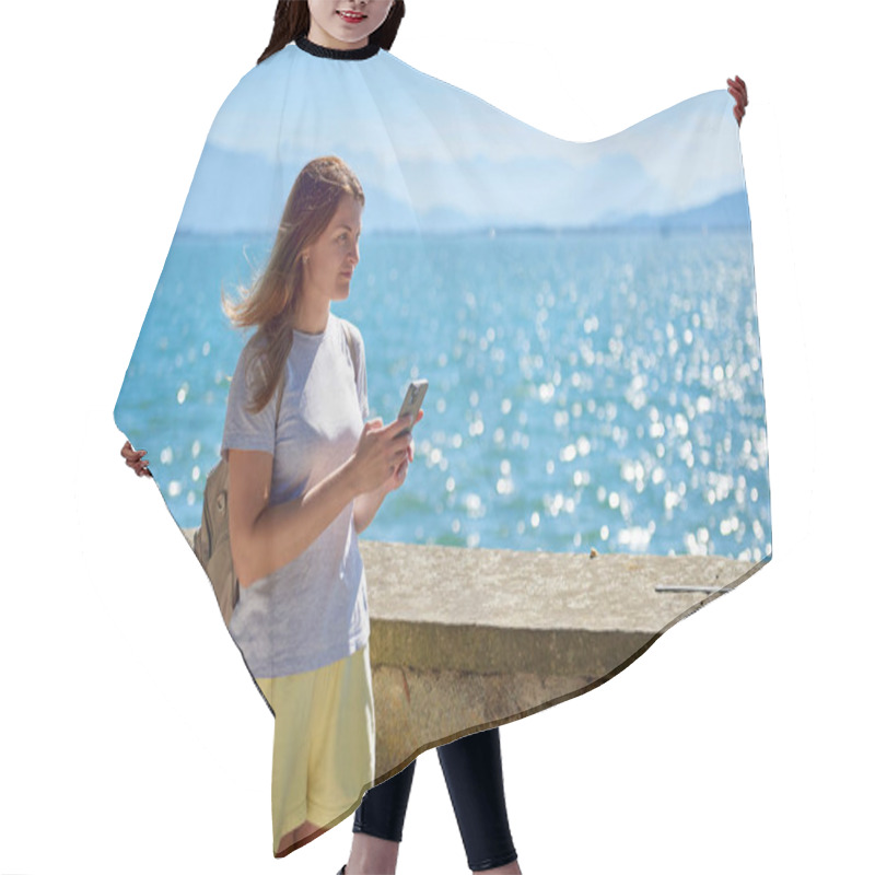 Personality  Woman Capturing Scenic Photos By A Sparkling Lake On A Sunny Day With Majestic Mountain Views. Idyllic Lakeside Setting Showcases Natural Beauty And Outdoor Adventure In A Serene European Landscape Hair Cutting Cape