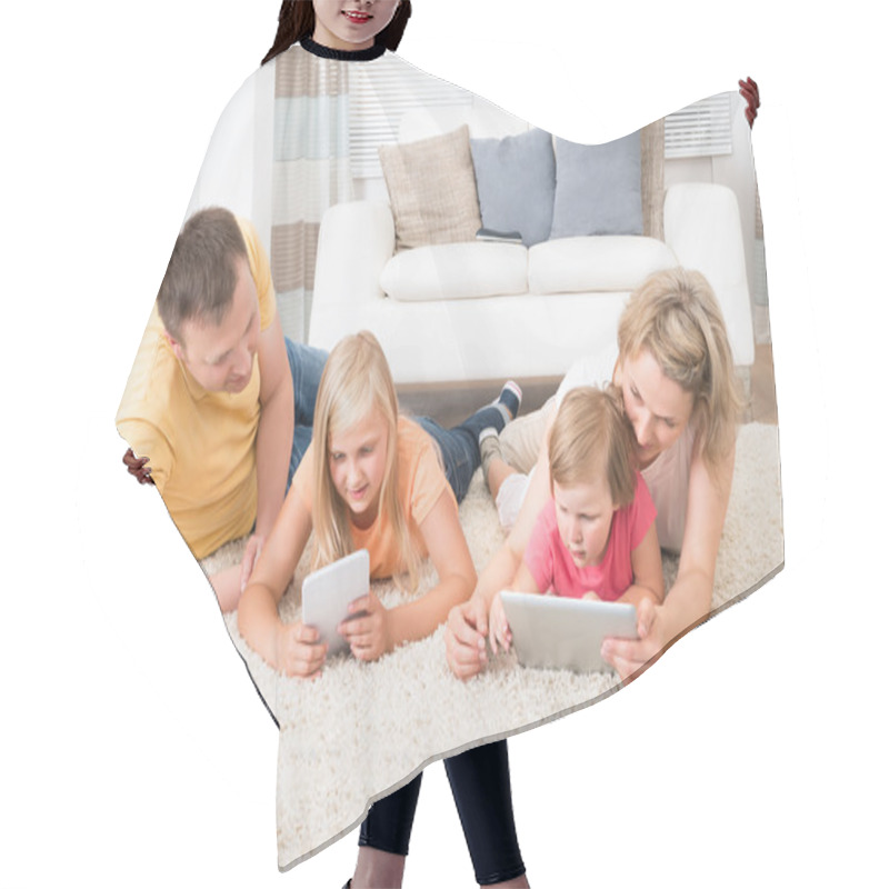 Personality  Family Using Tablets Lying On Carpet Hair Cutting Cape