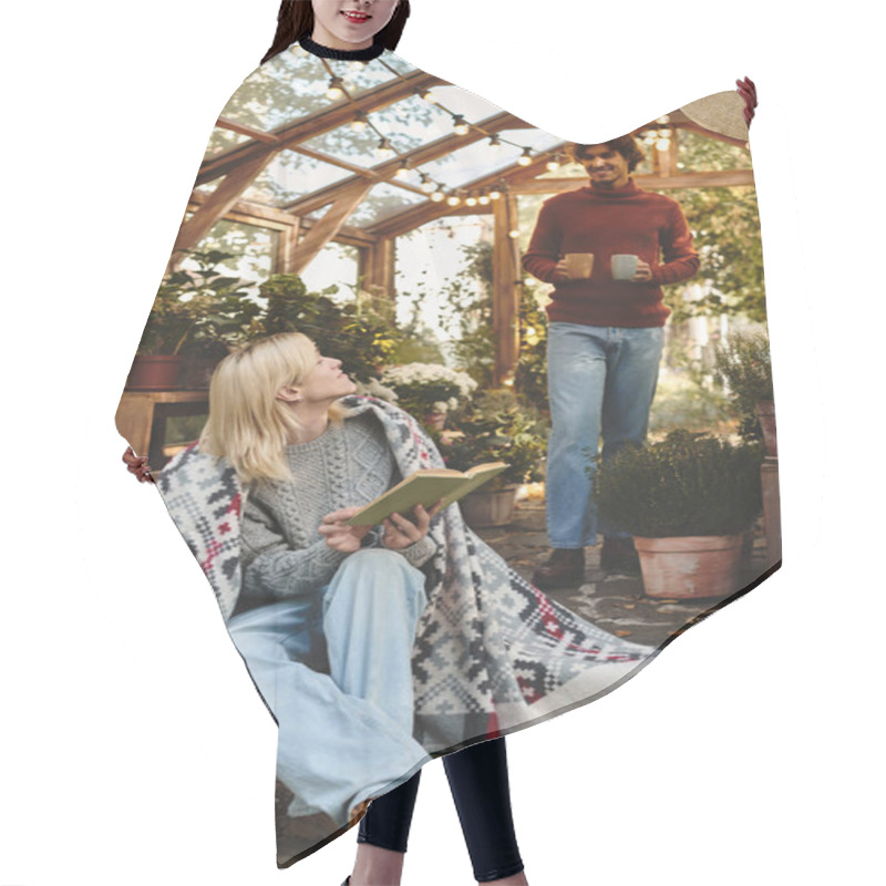 Personality  Young People Enjoy A Serene Moment Inside A Greenhouse, Surrounded By Lush Plants And Flowers. One Person Reads A Book While The Other Approaches With Warm Drinks, Fostering A Lively Atmosphere. Hair Cutting Cape