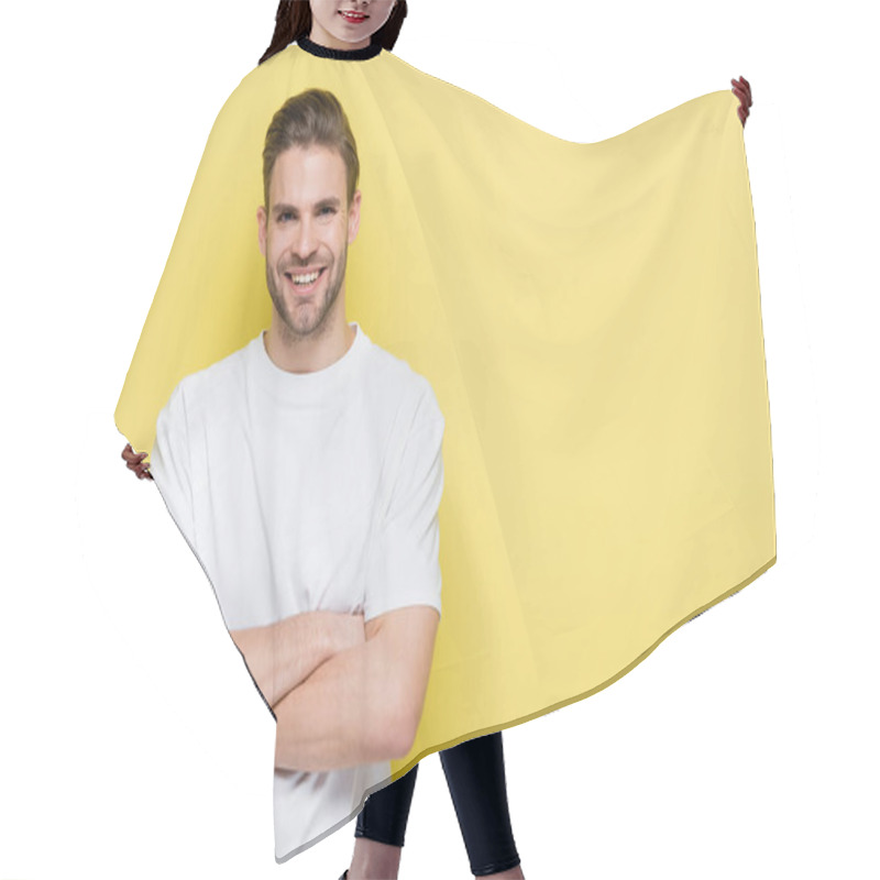 Personality  Happy Man Smiling At Camera While Standing With Crossed Arms On Yellow Hair Cutting Cape