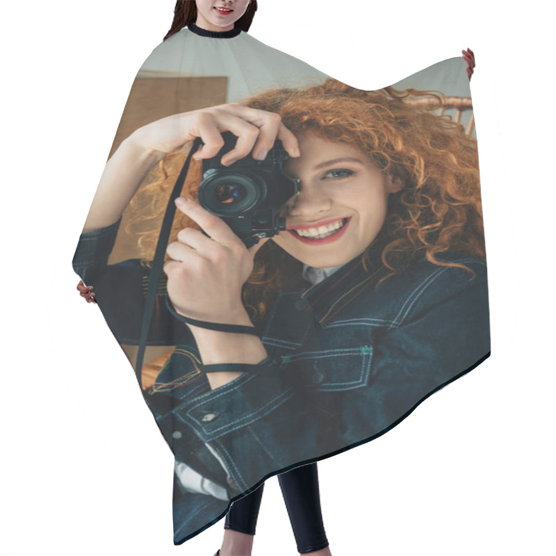 Personality  Smiling Stylish Redhead Woman In Wicker Chair Taking Photo With Film Camera Isolated On Grey Hair Cutting Cape