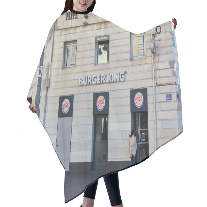 Personality  Marseille. France  - December 04, 2024: This Photo Captures The Main Entrance Of A Burger King Situated In An Old Stone Building. The Recognizable Sign Is Displayed Above The Door, With A Person Walking In, Indicating The Restaurant Is Active. Hair Cutting Cape