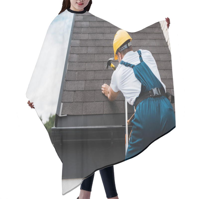 Personality  Back View Of Handyman In Uniform And Helmet Repairing Roof While Standing On Ladder  Hair Cutting Cape