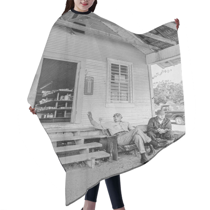 Personality  Macedonia, Arkansas, United States  June 23,  2024: Horizontal Shot Of Two Men Sitting And Talking Outside A 1970s Old Country Store. Hair Cutting Cape