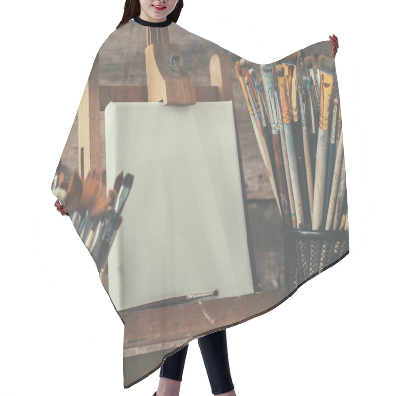 Personality  Artistic Equipment: Empty Artist Canvas On Easel And Paint Brushes In A Artist Studio. Retro Toned Photo. Hair Cutting Cape