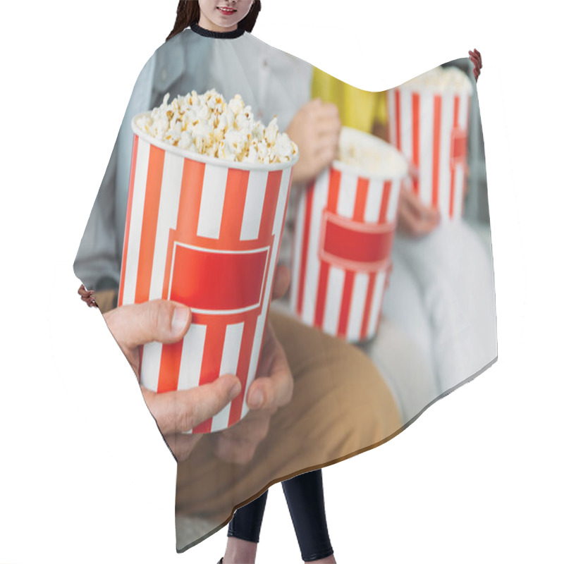 Personality  Cropped Shot Of Family Sitting With Buckets Of Popcorn Hair Cutting Cape