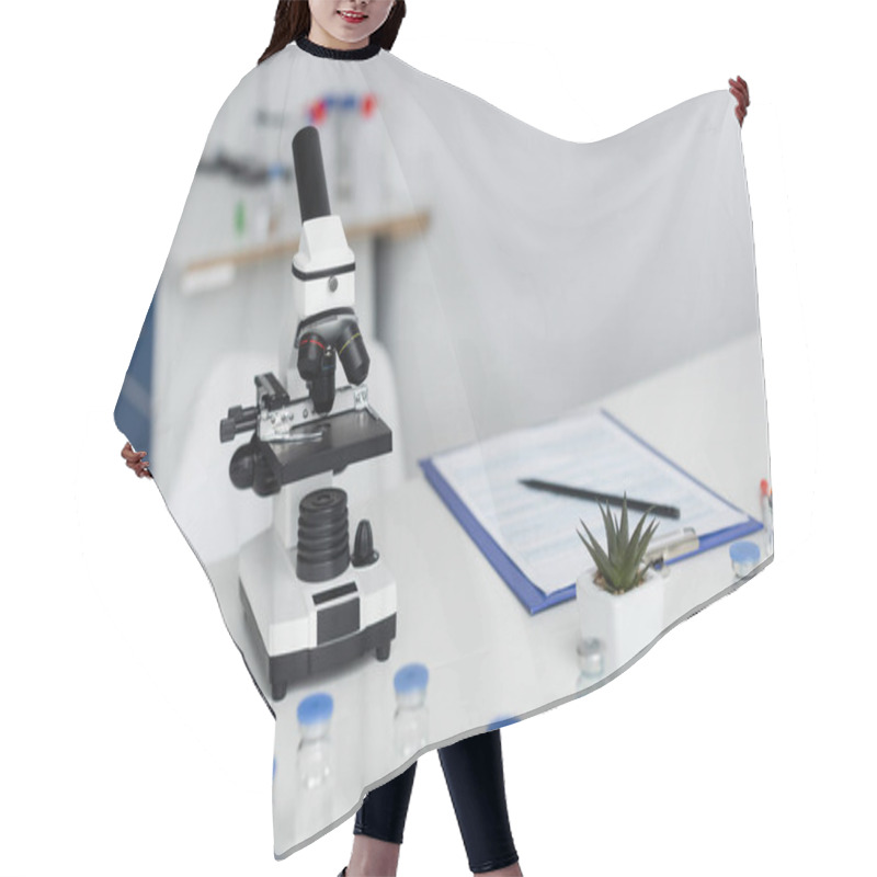 Personality  Microscope Near Vaccines And Clipboard On Blurred Background In Laboratory  Hair Cutting Cape