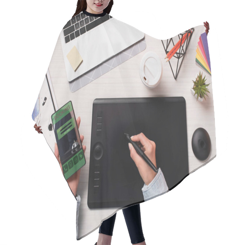 Personality  Cropped View Of Designer Using Graphics Tablet, Pen And Smartphone With Booking App On Screen, Flat Lay Hair Cutting Cape