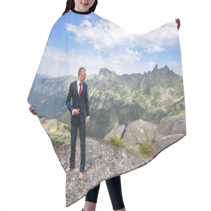 Personality  Portrait Of A Young Man In A Business Suit At The Top Of The Mountain On The Background Of Mountains And Blue Sky On A Sunny Summer Day Hair Cutting Cape