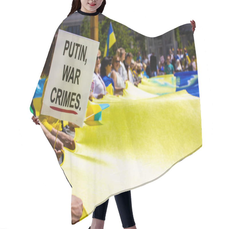 Personality  Madrid, Spain. May 8, 2022. A Crowd At Rally In Support Of Ukraine. People Holding A Huge Yellow Blue Ukrainian Flag. Placard 'Putin War Crimes'. Hair Cutting Cape