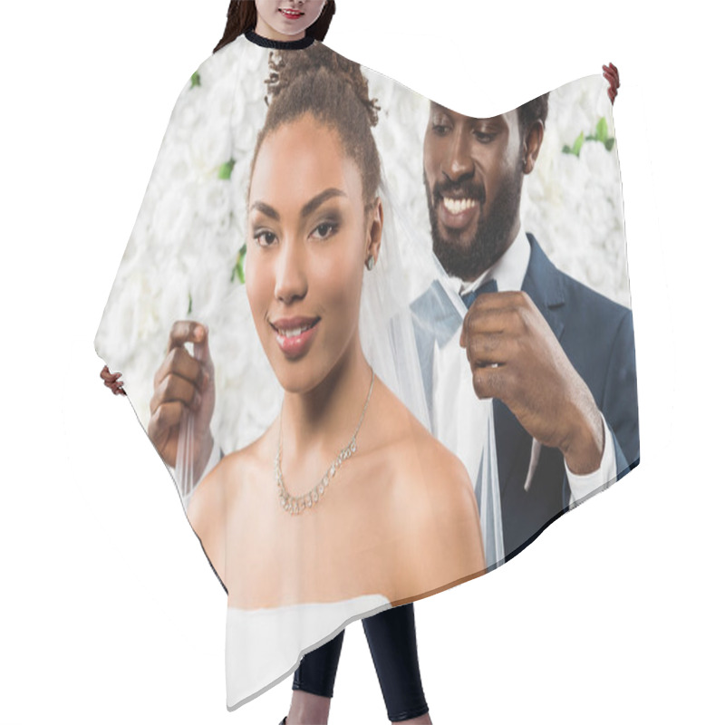 Personality  Selective Focus Of Happy African American Bride In White Veil Smiling Near Bridegroom And Flowers  Hair Cutting Cape