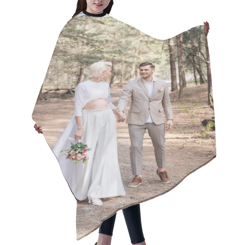 Personality  Full Length View Of Smiling Just Married Couple Holding Hands And Looking At Each Other In Forest Hair Cutting Cape