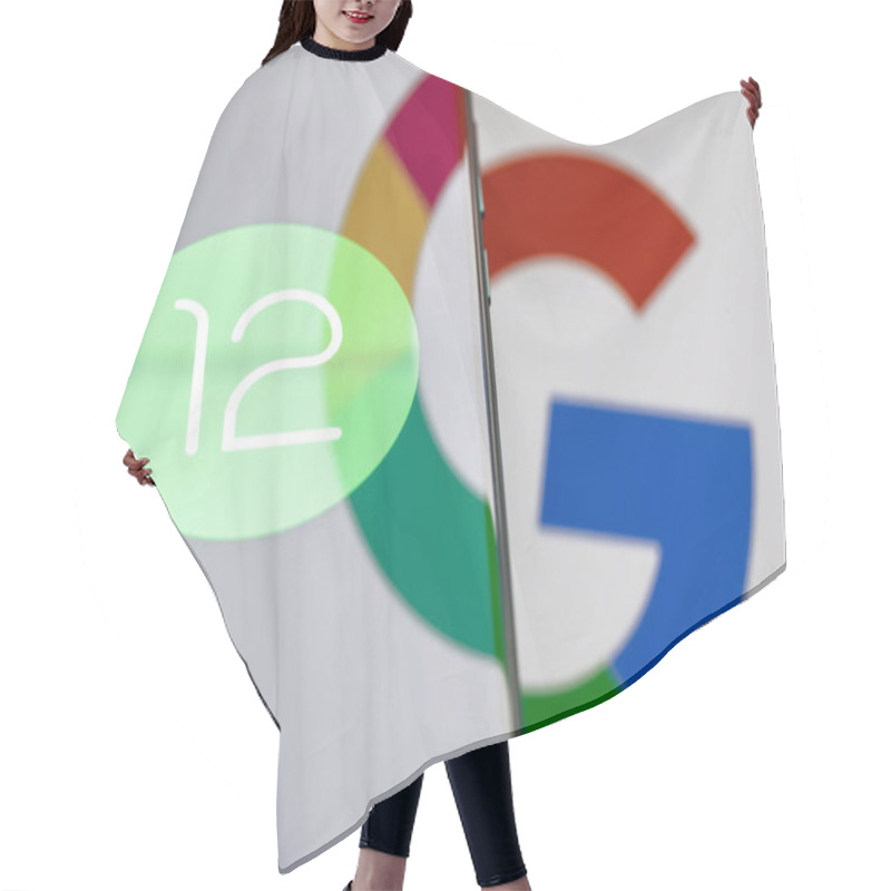 Personality  Kazan, Russia - May 29, 2021: Android Is A Mobile Operating System. The Twelfth Version Of The Android Operating System Developed By Google. Android 12 Logo On Smartphone Screen. Hair Cutting Cape