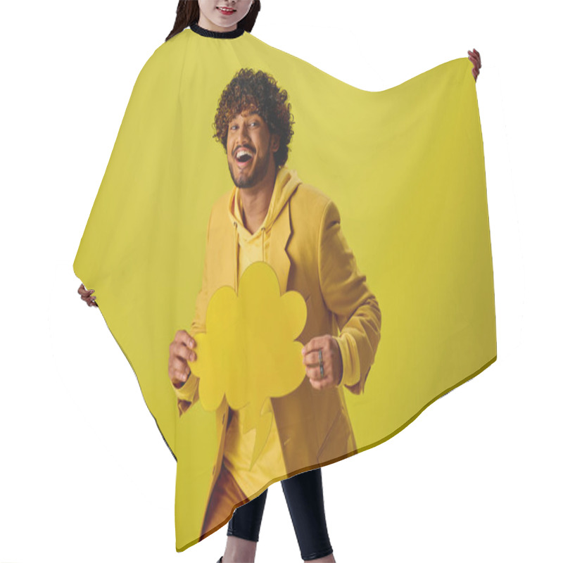 Personality  Handsome Indian Man In Vibrant Yellow Jacket Holding A Delicate Speech Bubble. Hair Cutting Cape