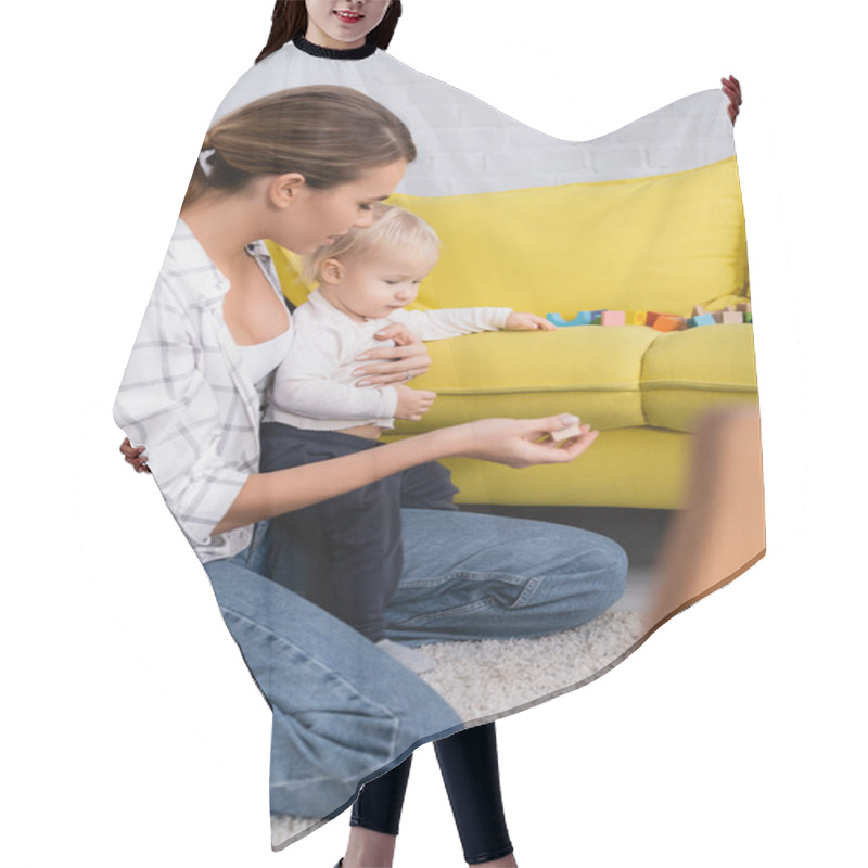 Personality  Mother Giving Toy Cube To Son While Playing On Floor On Blurred Foreground Hair Cutting Cape