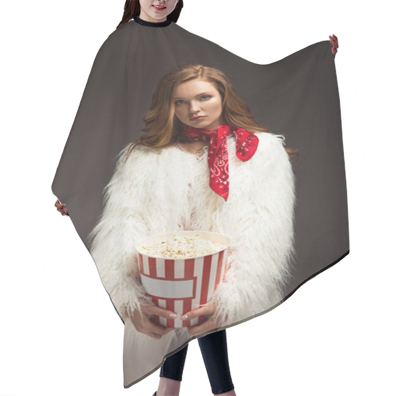 Personality  Serious Woman In Stylish Outfit Standing With Popcorn Box Isolated On Gray Hair Cutting Cape