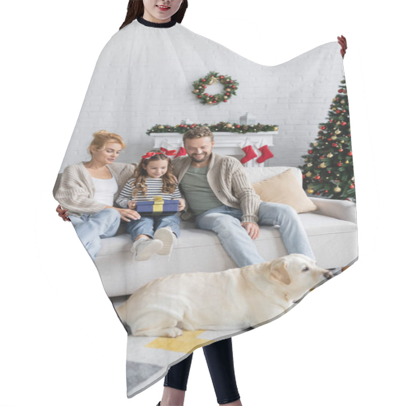 Personality  Smiling Parents And Girl With New Year Gift Looking At Labrador On Floor At Home  Hair Cutting Cape