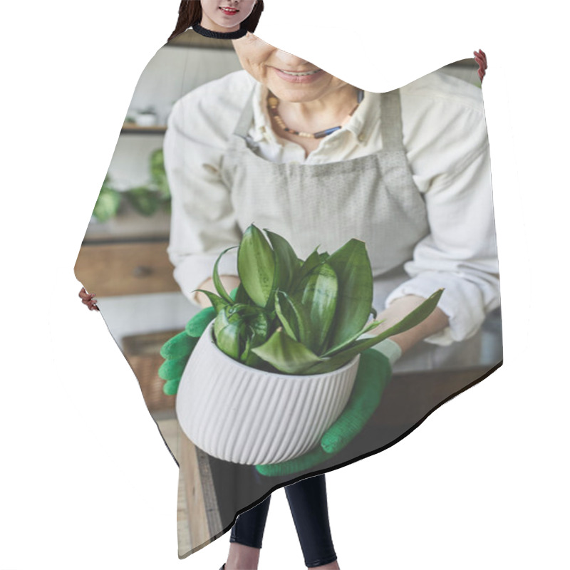 Personality  A Woman Lovingly Tends To Her Thriving Plants In Her Sunlit Studio. Hair Cutting Cape