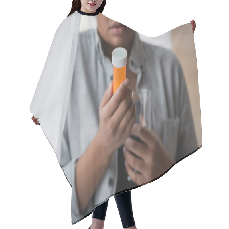 Personality  Cropped View Of Blurred Multiracial Woman Holding Antidepressant Pills And Water Near Curtain At Home Hair Cutting Cape