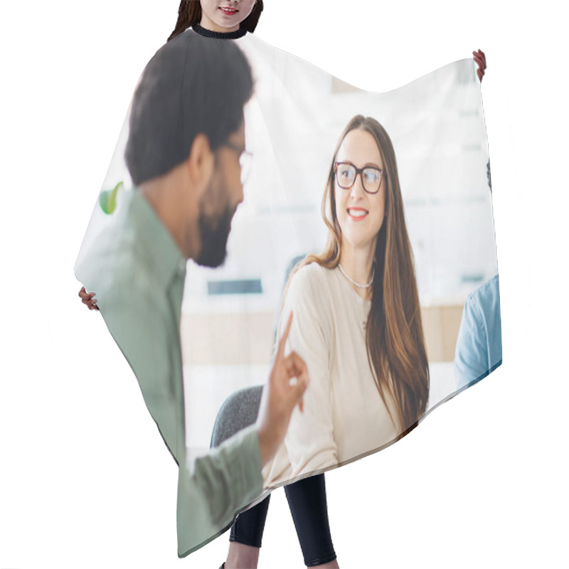 Personality  A Team Meeting In Progress, Where A Man In A Green Jacket Speaks To His Attentive Colleagues, Representing A Collaborative Workplace And Effective Team Communication. Morning Meeting In Modern Office Hair Cutting Cape