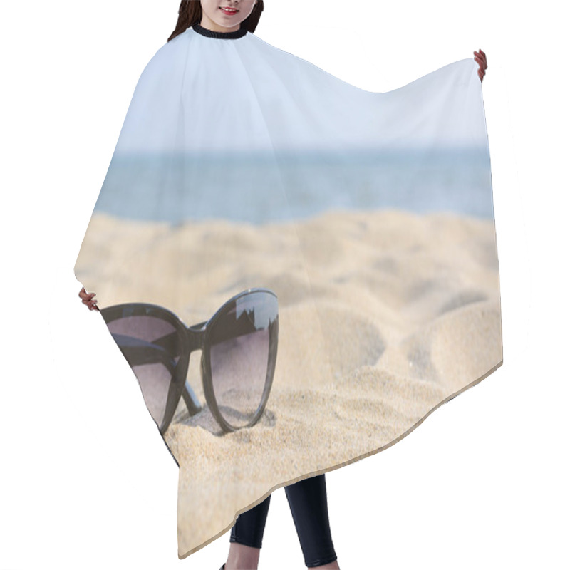 Personality  Stylish Sunglasses On Sandy Beach Near Sea, Space For Text Hair Cutting Cape