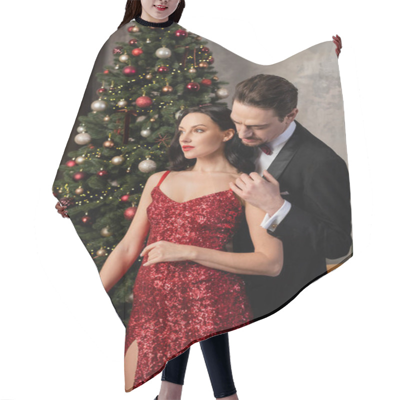 Personality  Wealthy Couple, Handsome Man In Tuxedo Hugging Attractive Wife In Red Dress Near Christmas Tree Hair Cutting Cape