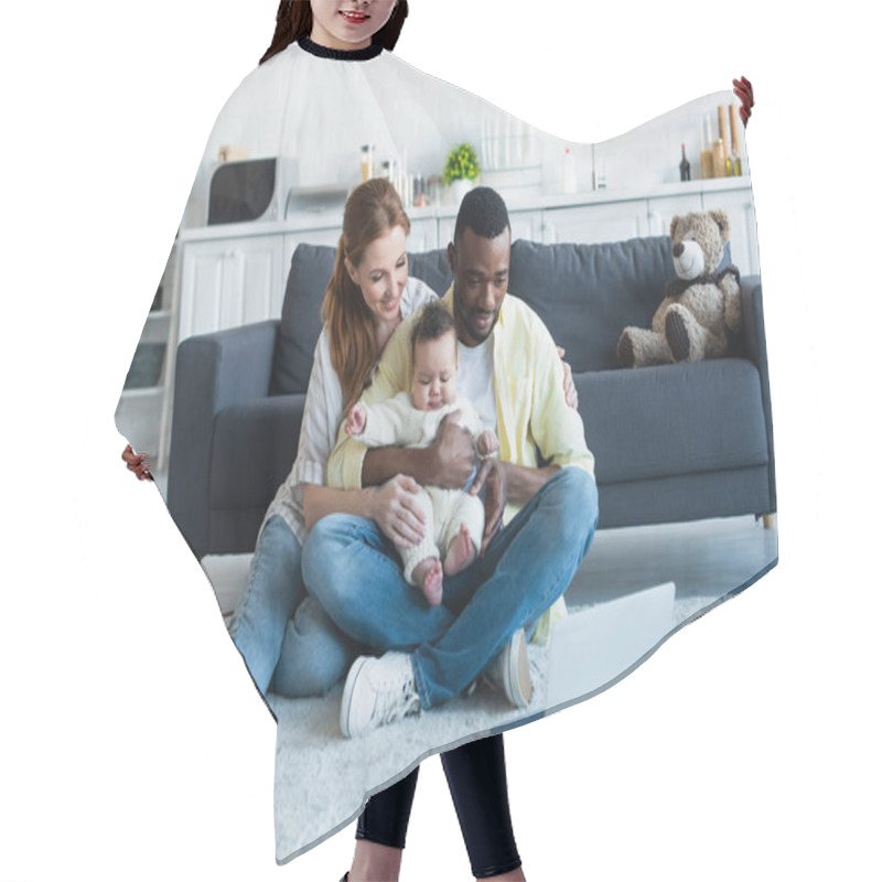 Personality  Multicultural Parents With Baby Girl Watching Movie On Laptop On Floor Hair Cutting Cape