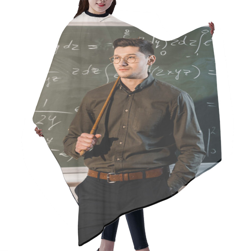 Personality  Serious Male Teacher In Formal Wear Holding Wooden Pointer In Front Of Chalkboard With Equations  Hair Cutting Cape