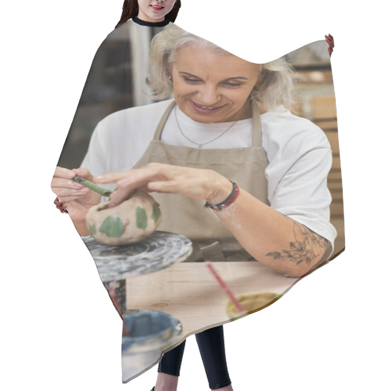 Personality  A Skilled Mature Woman Carefully Shapes Her Pottery Artwork With Passion And Joy. Hair Cutting Cape