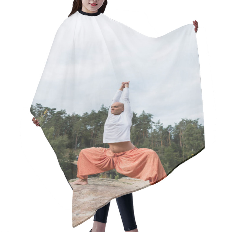 Personality  Buddhist In Harem Pants And Sweatshirt Meditating With Raised Hands In Goddess Pose Hair Cutting Cape