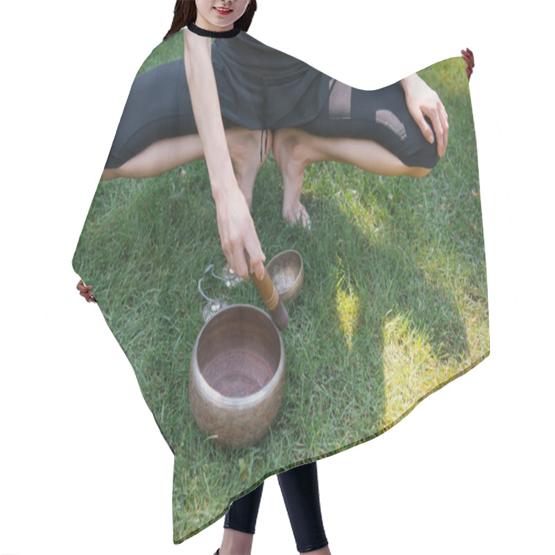 Personality  Cropped Image Of Woman Squatting And Making Sound With Tibetan Singing Bowls Hair Cutting Cape