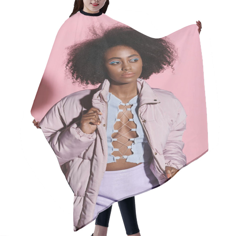 Personality  A Fashionable African American Woman With An Afro Hairstyle Poses Confidently In Front Of A Vibrant Pink Background. Hair Cutting Cape