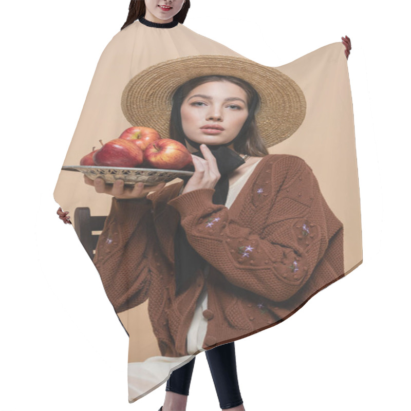 Personality  Portrait Of Stylish Woman In Straw Hat Holding Apples On Plate On Beige Background  Hair Cutting Cape