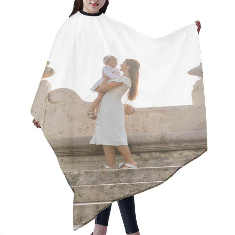 Personality  Cheerful Woman Holding Toddler Daughter On Stone Stairs Of Puente Del Mar Bridge In Valencia Hair Cutting Cape