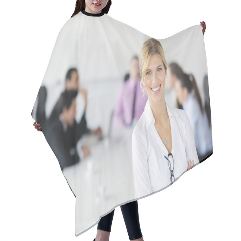 Personality  Business Woman Standing With Her Staff In Background Hair Cutting Cape