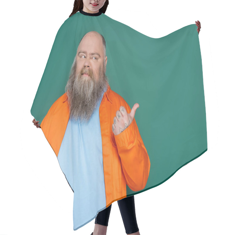 Personality  Bearded Plus Size Man Feeling Disgusted And Pointing With Thumb Isolated On Green Hair Cutting Cape