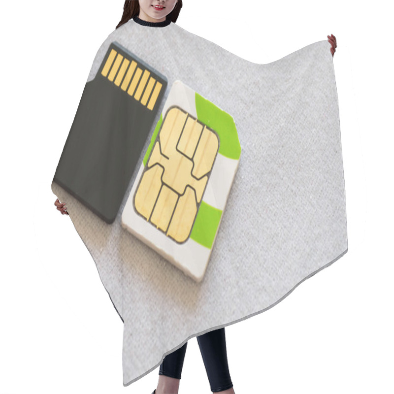 Personality  A Micros SIM Next To A Micro SD Card Hair Cutting Cape