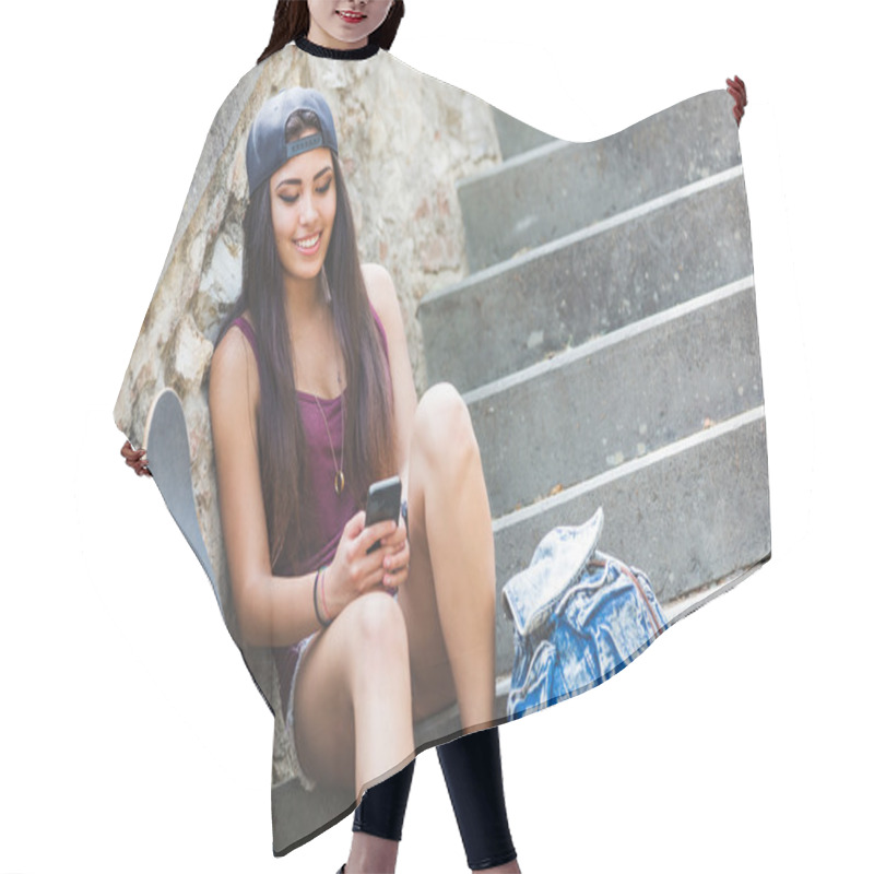 Personality  Portrait Of A Beautiful Skater Girl Looking At Smart Phone Hair Cutting Cape