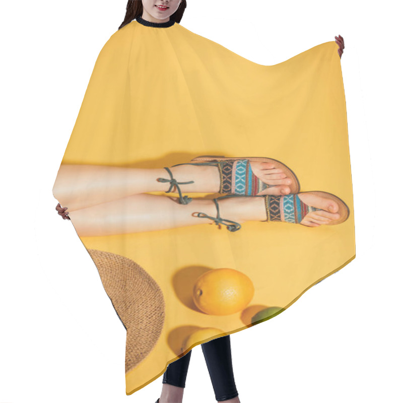 Personality  Cropped Shot Of Citrus Fruits, Woman Feet In Stylish Sandals And Straw Hat On Yellow Background Hair Cutting Cape