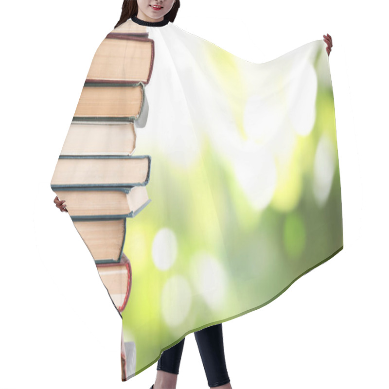 Personality  Collection Of Different Books On Blurred Green Background, Space For Text Hair Cutting Cape