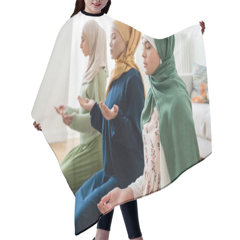 Personality  Teenager Praying Near Blurred Multiethnic Family At Home  Hair Cutting Cape