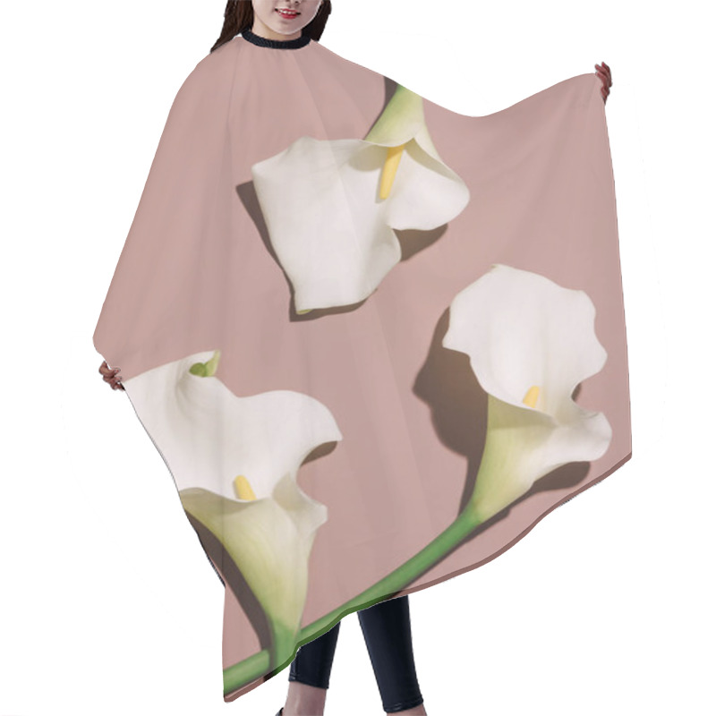 Personality  Beautiful Calla Flowers On Brown Background. Above View  Hair Cutting Cape