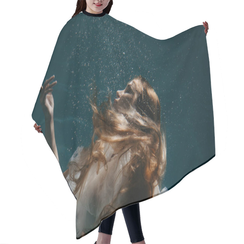 Personality  Portrait Of Beautiful Swimming And Diving Woman In Bridal Dress Underwater. Hair Cutting Cape