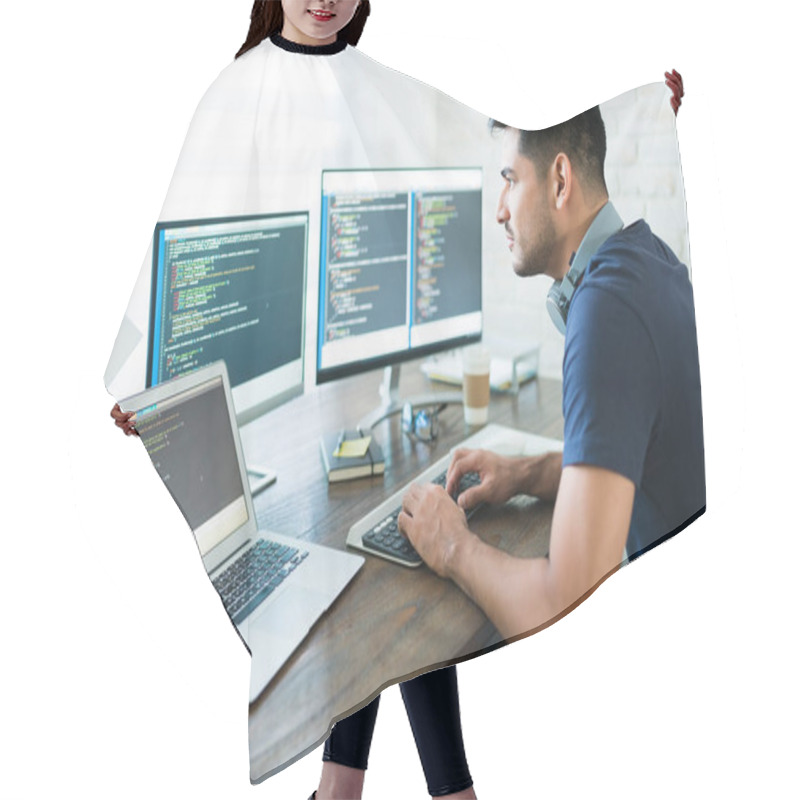 Personality  Side View Of Attractive Hispanic Software Developer Programming Using Computer While Working From Home Hair Cutting Cape