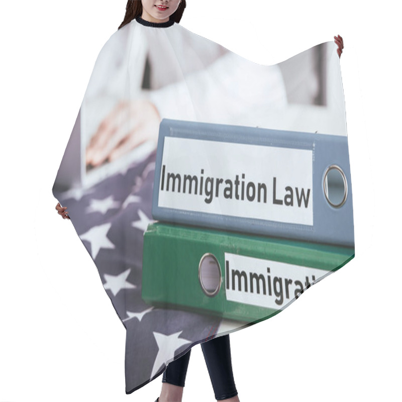 Personality  Selective Focus Of Folders With Immigration Law Lettering With Woman Using Laptop On Background  Hair Cutting Cape