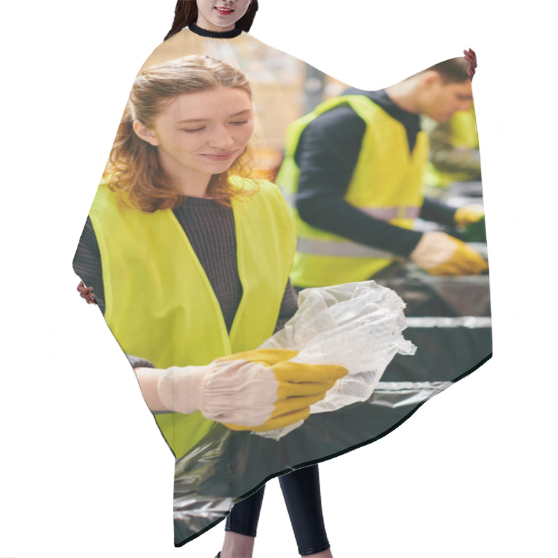 Personality  A Young Woman In A Yellow Vest Diligently Cleans Up Trash As Part Of A Volunteer Effort To Keep The Environment Clean. Hair Cutting Cape