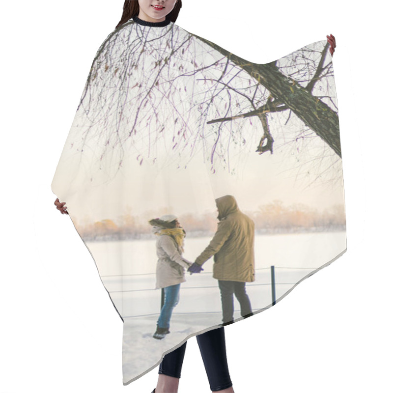 Personality  Theme Love And Active Rest On Rustic Nature. Young Couple Caucasian Guy And Girl Stand Back In Full Growth Holding Hands In Winter On Snow Pier Overlooking Frozen Lake Beautiful View Of Horizon. Hair Cutting Cape