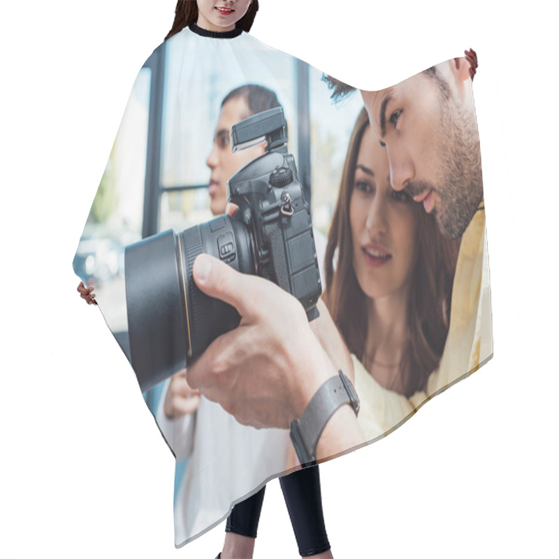 Personality  Selective Focus Of Attractive Art Director Looking At Digital Camera Near Photographer  Hair Cutting Cape